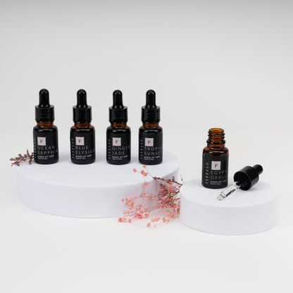 Set of black dropper bottles on a white background